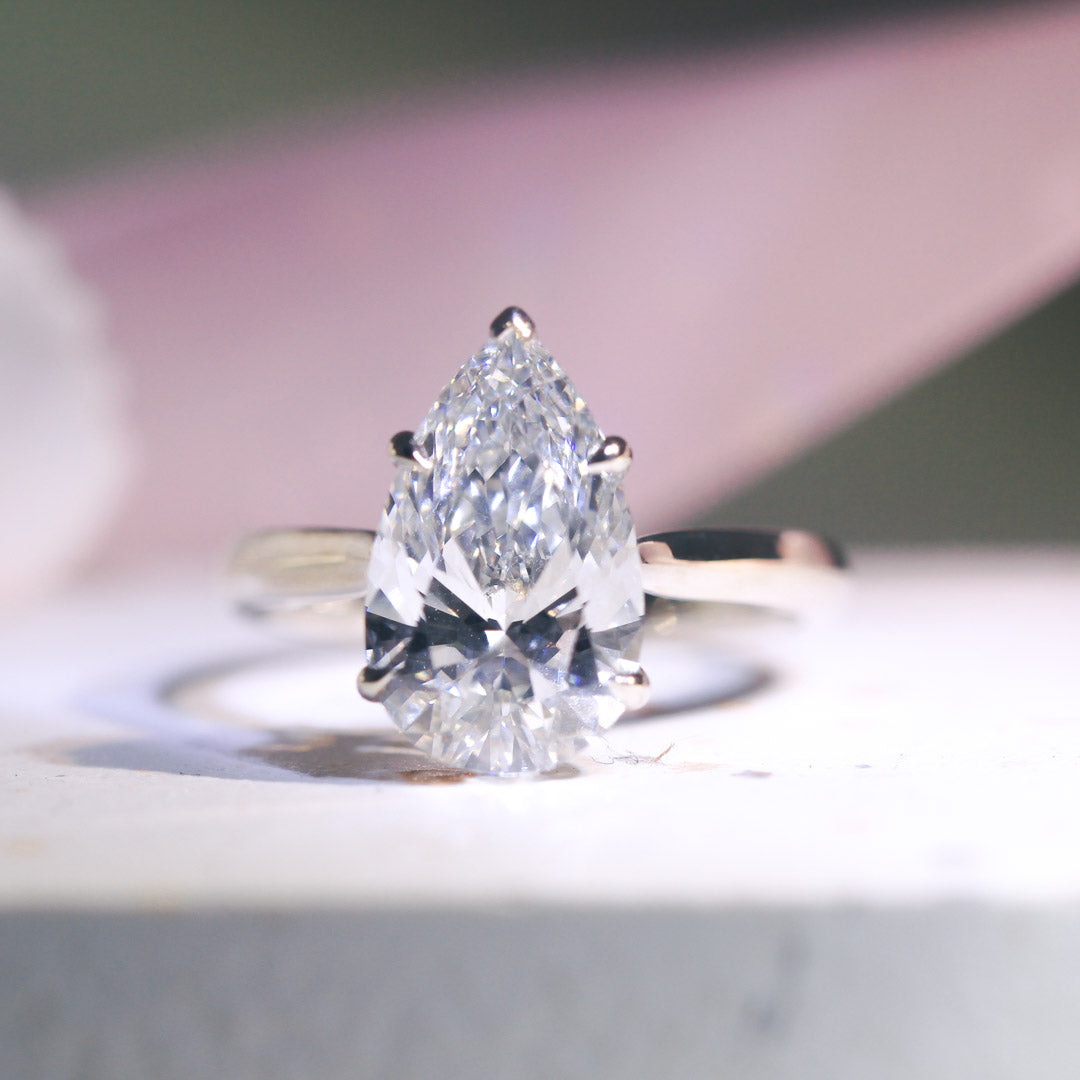 CELESTE – Pear-cut Lab-Grown Diamond / Gemstone Ring Setting | Solitaire with Infinity-Inspired Gallery & Tapered Band (18K Gold / Platinum) - TM0810PE